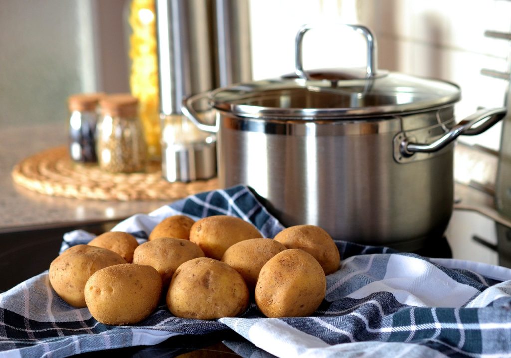potato starch and gout: potatoes alongside a pan